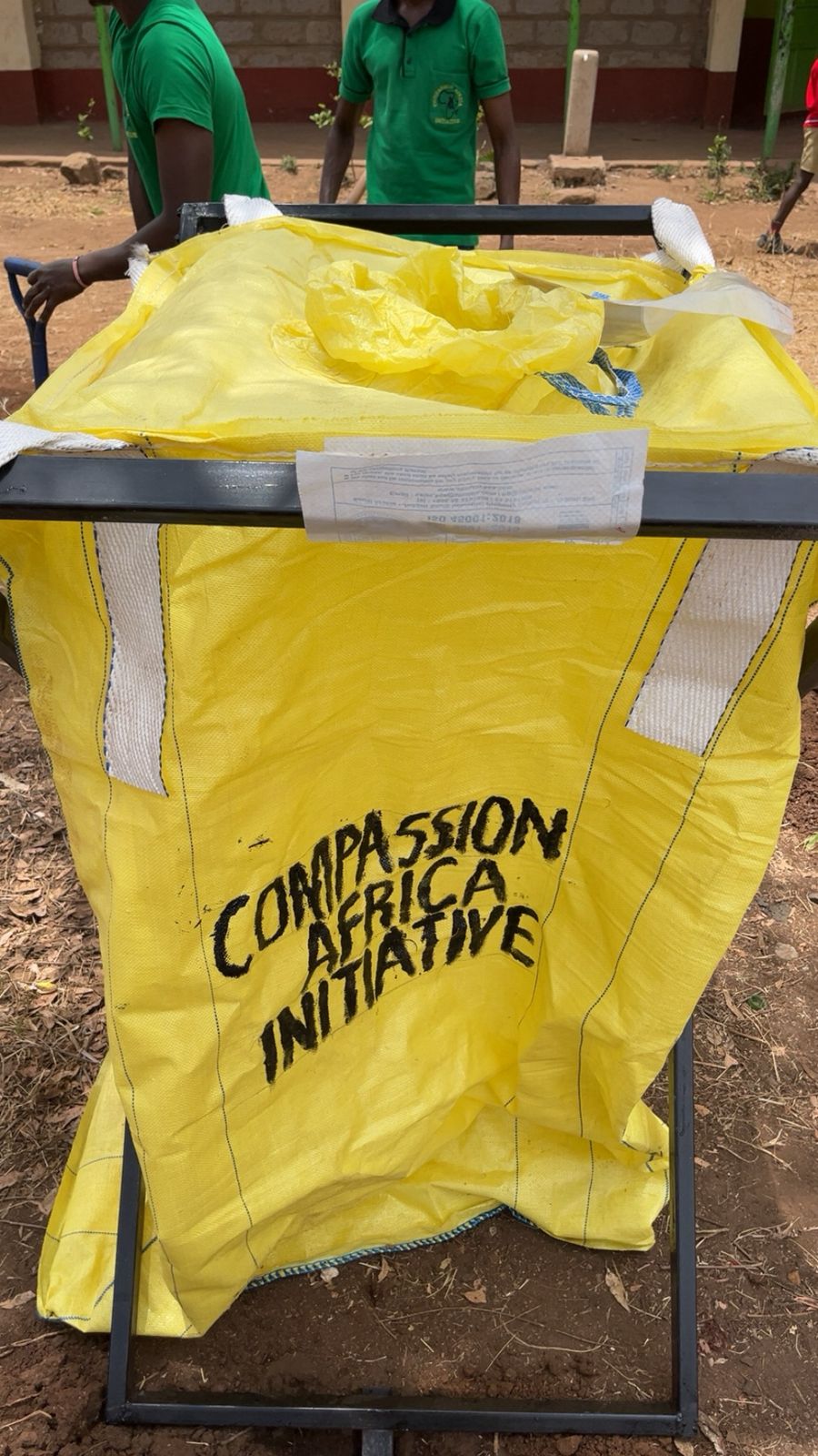 Komo Secondary Partnership Launch - Environment club members with planted trees